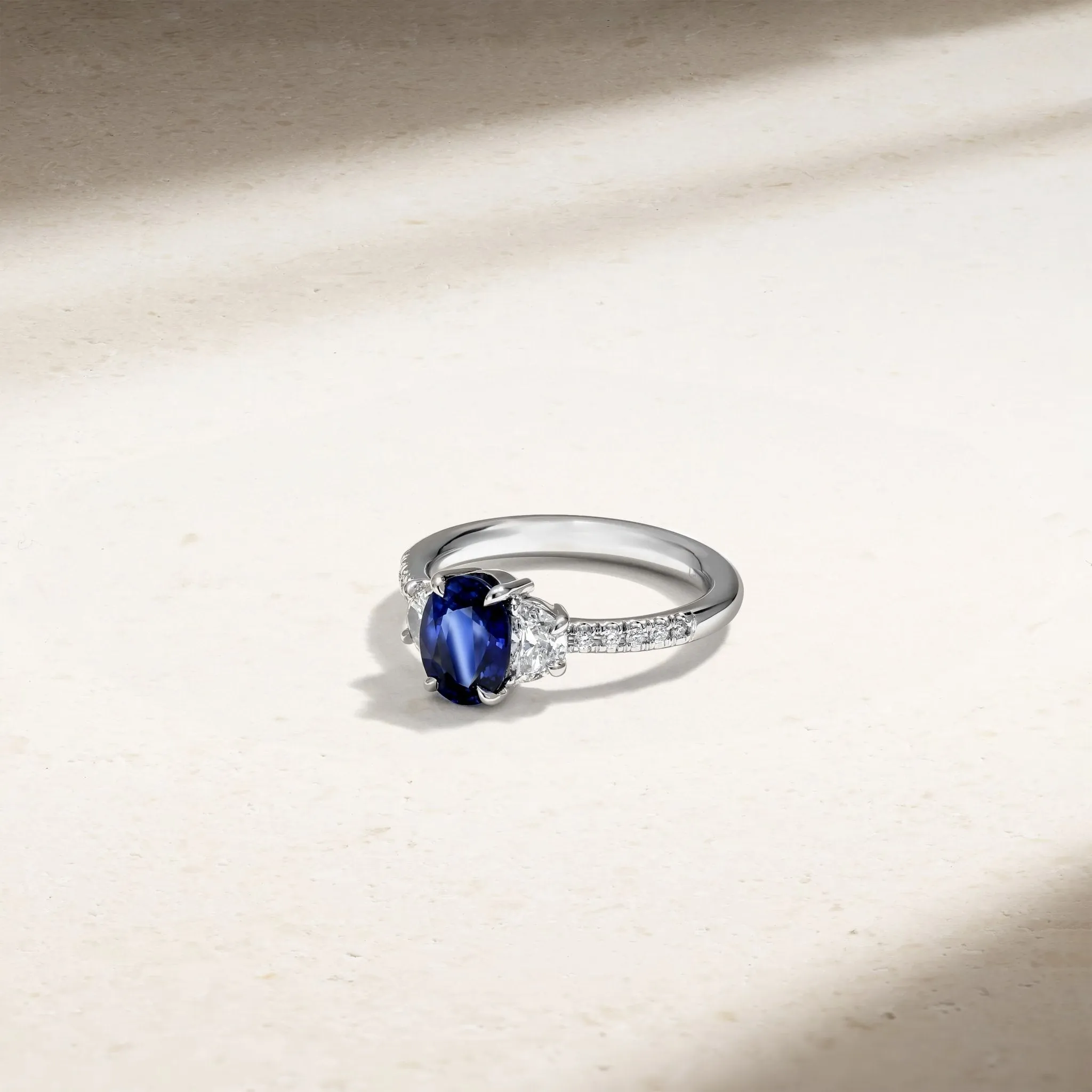 Nouveau Three Stone Oval Sapphire and Diamond Ring